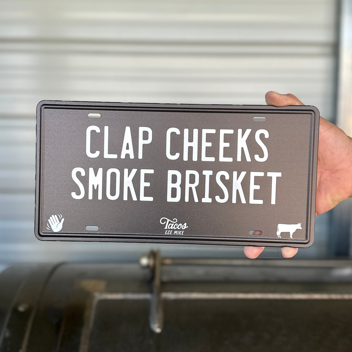 CLAP CHEEKS SMOKE BRISKET - Metal License Plate Sign